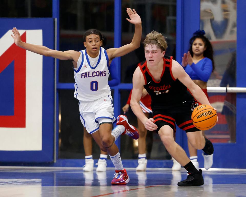 Dale's Dayton Forsythe (33) drives the ball against Millwood's Izaiah Wilson (0) during a high school basketball game, Tuesday, Jan. 23, 2024, at Millwood High School in Oklahoma City.