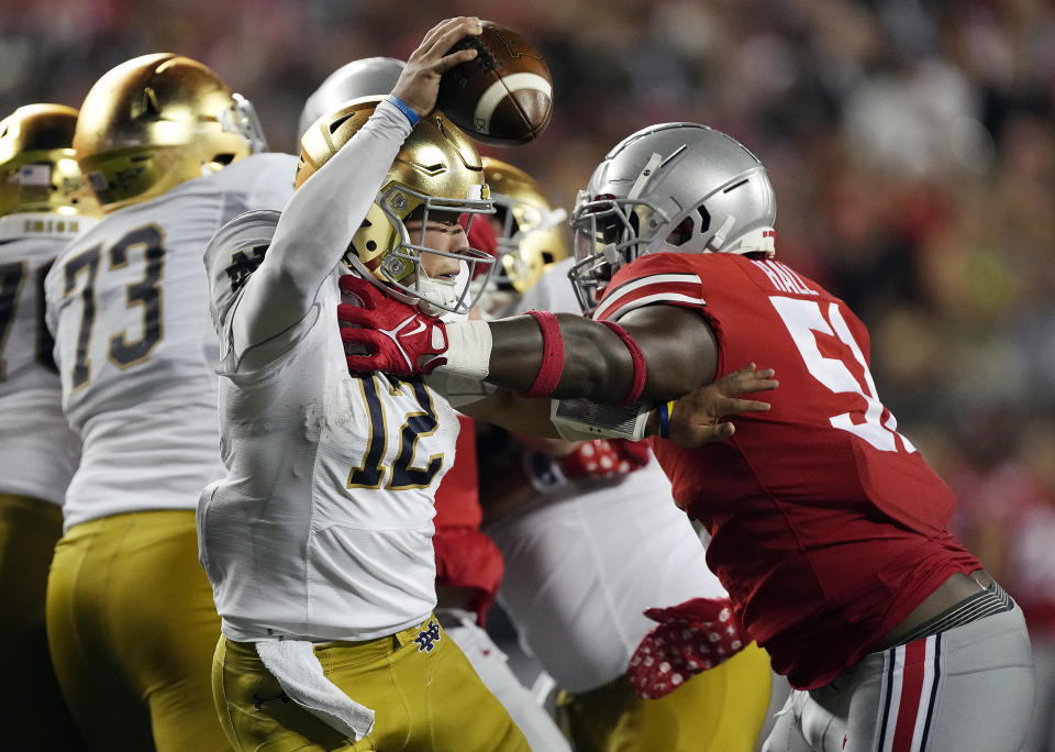 Sep 3, 2022; Columbus, Ohio, USA; Ohio State Buckeyes defensive tackle Michael Hall Jr. (51) sacks Notre Dame Fighting Irish quarterback Tyler Buchner (12) in the fourth quarter at Ohio Stadium. Mandatory Credit: Kyle Robertson-USA TODAY Sports