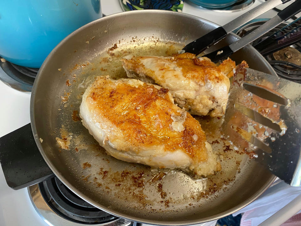 Cooking chicken breast in a skillet