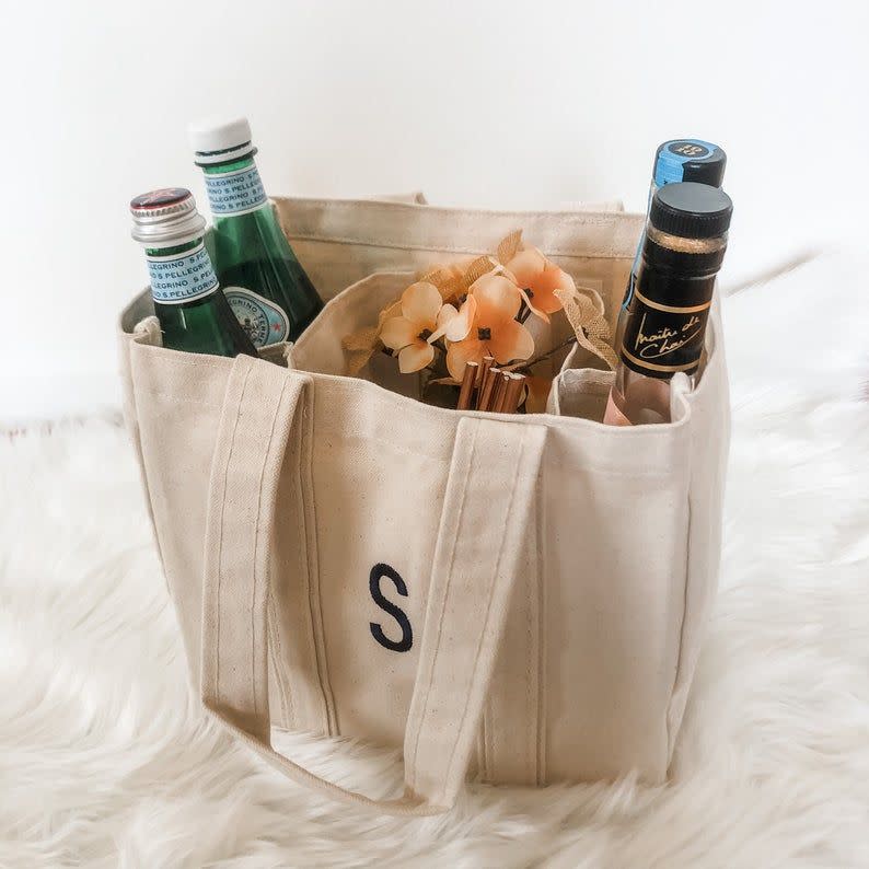 <p><strong>SEmbroideredBoutique</strong></p><p>etsy.com</p><p><strong>$23.00</strong></p><p>Wine totes > picnic baskets. Fact of life. This monogrammed design holds four bottles, and has an additional compartment for anything else you might need to carry (like snacks!). It's the perfect 30th-birthday gift for her to use during those fun park hangs.</p>