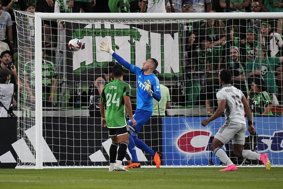 San Jose Earthquakes forward Jeremy Ebobisse (11) scores against Austin FC goalkeeper Brad Stuver (1) during the second half of an MLS soccer match in Austin, Texas, Saturday, April 29, 2023. (AP Photo/Eric Gay)