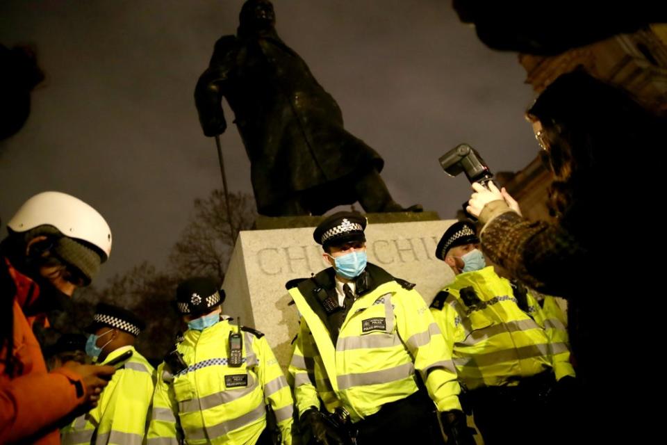 Police surround the statue of Sir Winston Churchill in Parliament Square (Aaron Chown/PA) (PA archive)