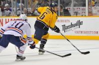 NASHVILLE, TN - MARCH 20: Shawn Horcoff #10 of the Edmonton Oilers skates against Shea Weber #6 of the Nashville Predators at the Bridgestone Arena on March 20, 2012 in Nashville, Tennessee. (Photo by Frederick Breedon/Getty Images)