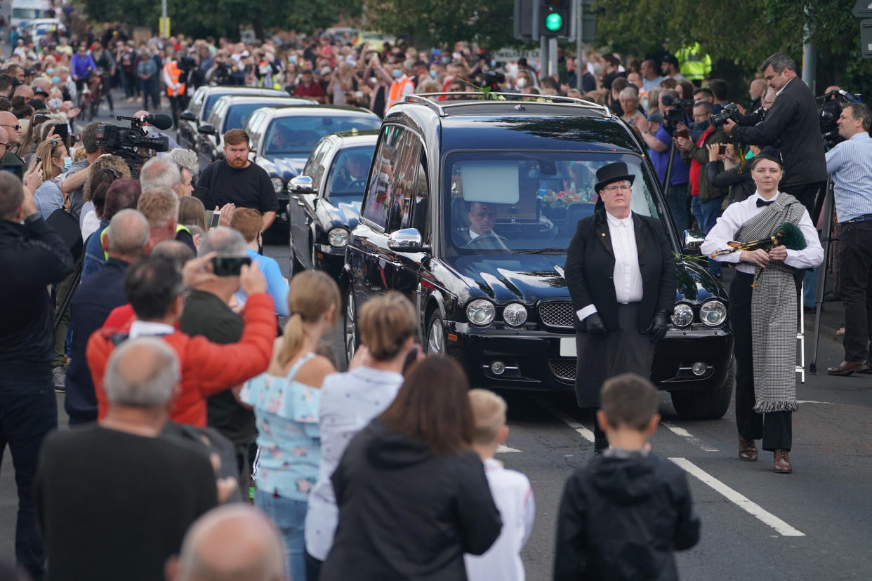 People line the streets as the funeral cortege of Jack Charlton passes through his hometown of Ashington, in Northumberland ahead of his funeral service at West Road Crematorium, in Newcastle. The former Republic of Ireland manager, who won the World Cup, playing for England, died on July 10 aged 85.