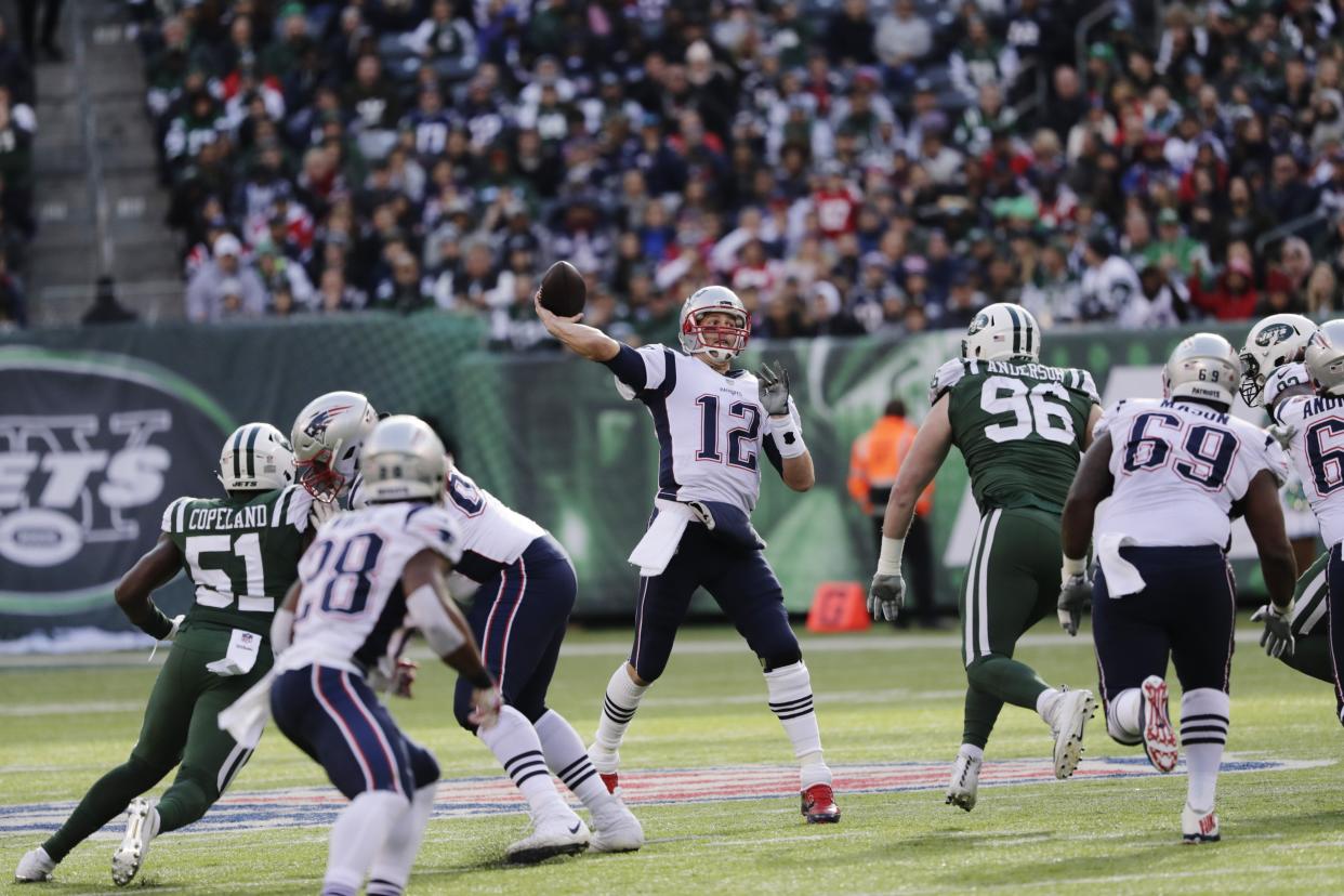 New England Patriots quarterback Tom Brady became the all-time combined passing yards leader on Sunday. (AP)