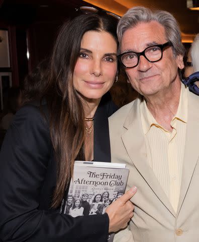 <p>Rochelle Brodin/Shutterstock</p> Sandra Bullock and Griffin Dunne