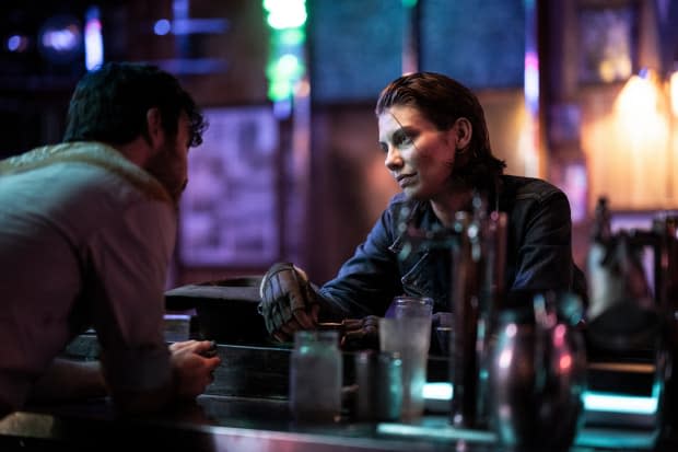 Charlie Solis as The Bartender and Lauren Cohen as Maggie Rhee in "The Walking Dead" spinoff "Dead City"<p>AMC</p>