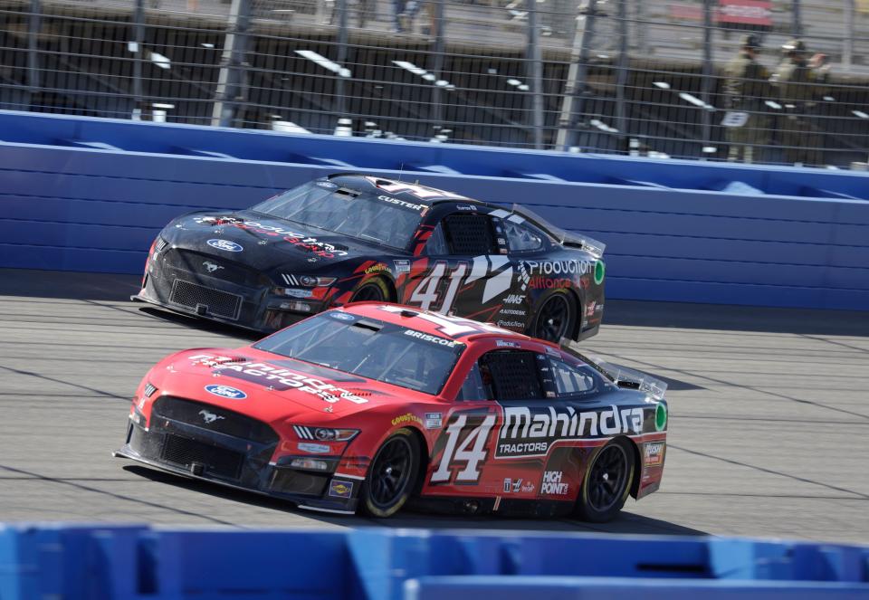 Mitchell's Chase Briscoe (14) duels for position with Stewart-Haas Racing teammate Cole Custer (41) during the Wise Power 400 in California. The SHR teams will compete at Charlotte Motor Speedway Sunday night.