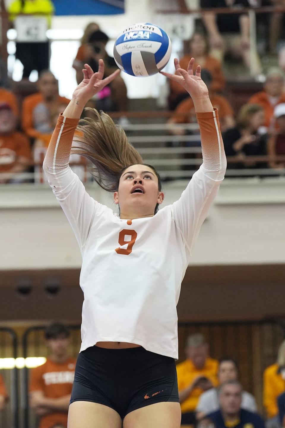 Texas' Saige Ka'aha'aina-Torres sets up a teammate during Thursday's win. The Longhorns had won 11 straight sets over the end of the regular season and the first two matches of the NCAA Tournament but dropped Thursday's third set.