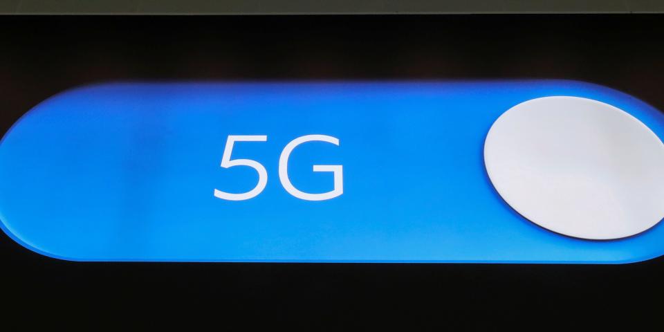FILE PHOTO: An advertising board shows a 5G logo at the International Airport in Zaventem, Belgium May 4, 2020. Picture taken May 4, 2020. REUTERS/Yves Herman