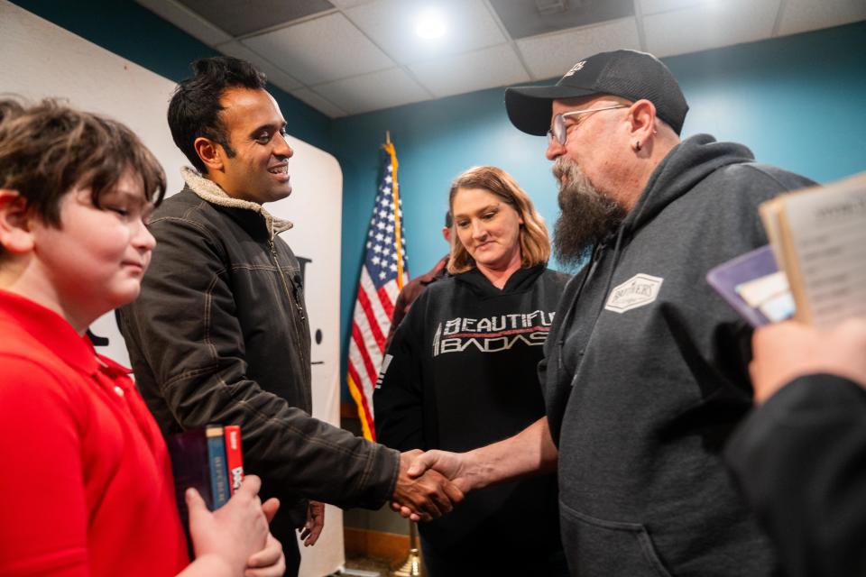 Republican presidential candidate Vivek Ramaswamy meets with voters after an event Dec. 20 in Marshalltown, Iowa.