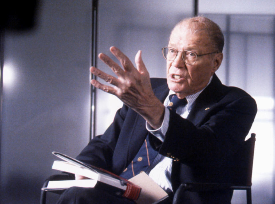 Robert McNamara sitting and gesturing