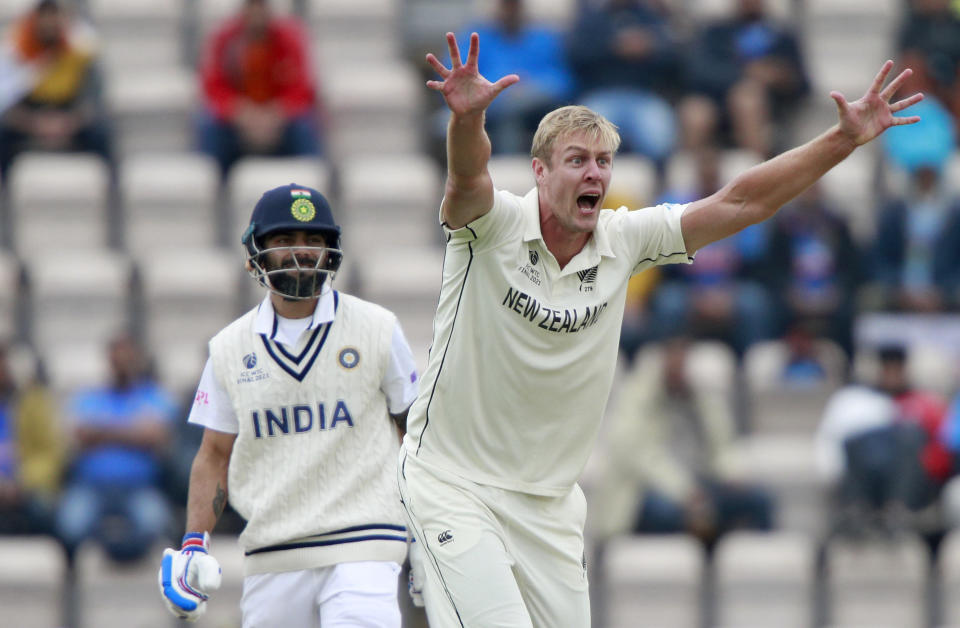 New Zealand's Kyle Jamieson, right, appeals successfully for the wicket of India's captain Virat Kohli, left, during the third day of the World Test Championship final cricket match between New Zealand and India, at the Rose Bowl in Southampton, England, Sunday, June 20, 2021. (AP Photo/Ian Walton)