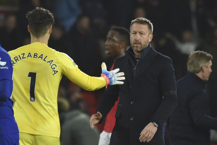 Chelsea's head coach Graham Potter greets Chelsea's goalkeeper Kepa Arrizabalaga after the English Premier League soccer match between Nottingham Forest and Chelsea at City ground in Nottingham, England, Sunday, Jan. 1, 2023. (AP Photo/Rui Vieira)