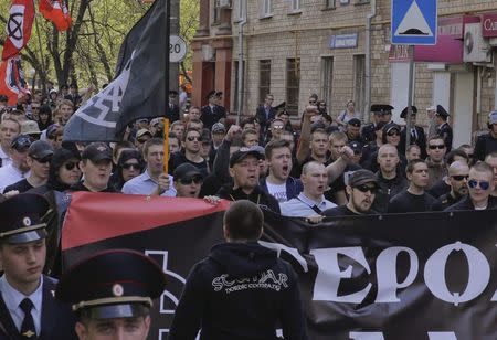 Russian nationalists carry flags and banners as they take part in a May Day rally in Moscow May 1, 2014. REUTERS/Tatyana Makeyeva