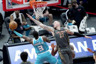Charlotte Hornets' Terry Rozier (3) shoots past the outstretched arm of Chicago Bulls' Daniel Theis during the first half of an NBA basketball game Thursday, April 22, 2021, in Chicago. (AP Photo/Charles Rex Arbogast)
