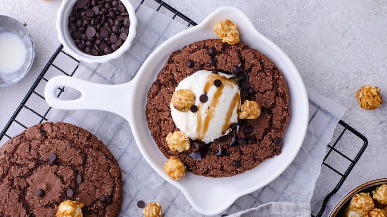 Skillet cookie with ice cream, chocolate chips, and popcorn