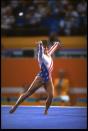 Mary Lou Retton performs her routine during the floor exercises at the 1984 Los Angeles Olympics. Retton finished in third place with a score of 19.775, but went on to win five medals, including the All Around Gold Medal in gymnastics. She’s the first American woman to win this title. (Getty Images)