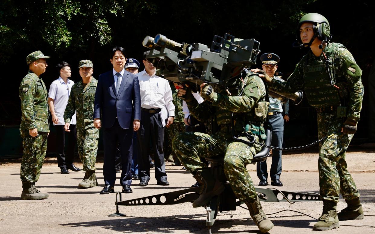 The President views a Stinger multiple missile launcher demonstration