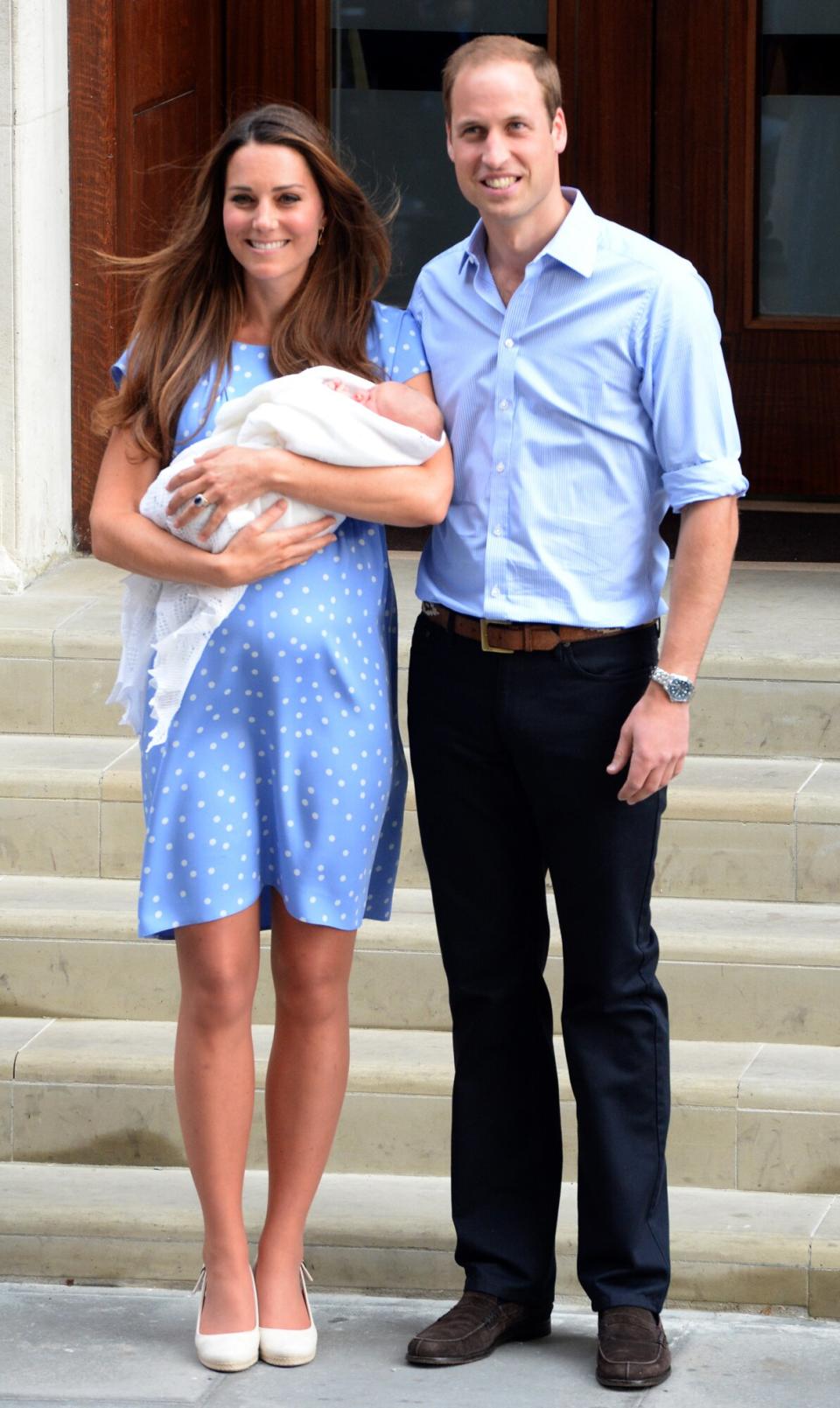 Prince William, Duke of Cambridge and Catherine, Duchess of Cambridge with their newborn son pose for the media before departing the Lindo Wing of St Mary's Hospital on July 23, 2013 in London, England.