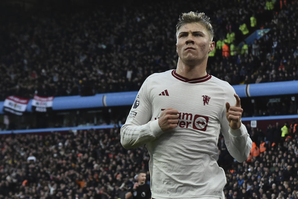 Manchester United's Rasmus Hojlund celebrates after scoring his side's opening goal during the English Premier League soccer match between Aston Villa and Manchester United at the Villa Park stadium in Birmingham, England, Sunday, Feb. 11, 2024. (AP Photo/Rui Vieira)