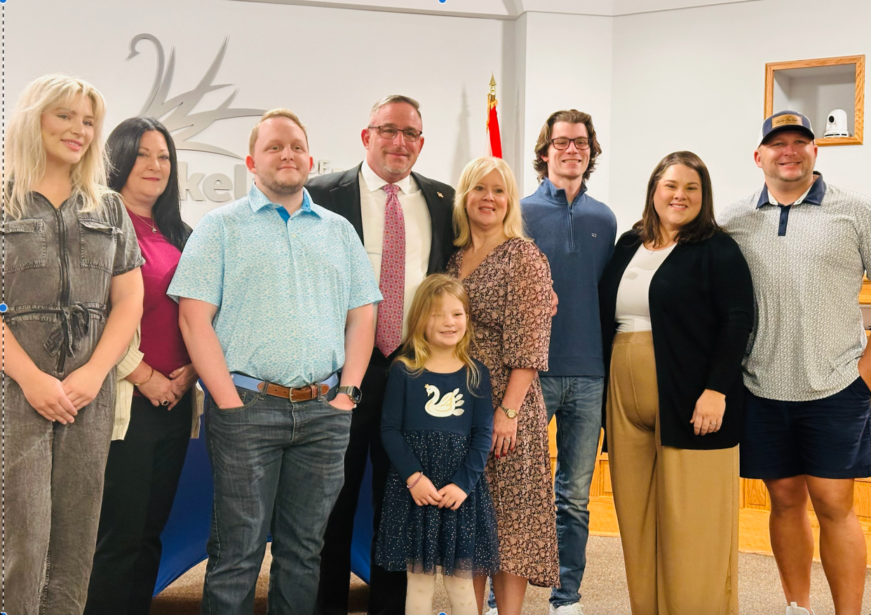 Newly sworn-in Commissioner Guy LaLonde, fourth from left, stands with his family on the dias of Lakeland City Hall's commission chambers Monday morning after taking the oath of office.