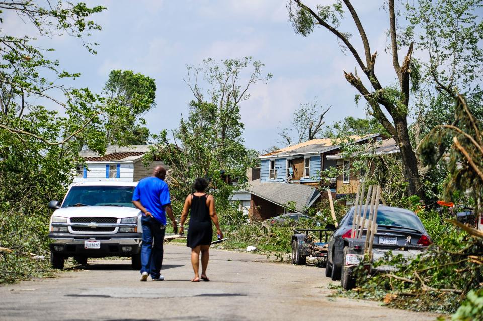 Houses and businesses in Trotwood were damage by tornadoes  May 27. Many streets were blocked for downed trees, power lines and debris scattered through the neighborhoods. These homes were on Olive Tree Drive. (WHIO File)