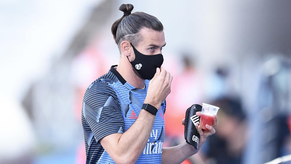 Gareth Bale leaving training with a drink.