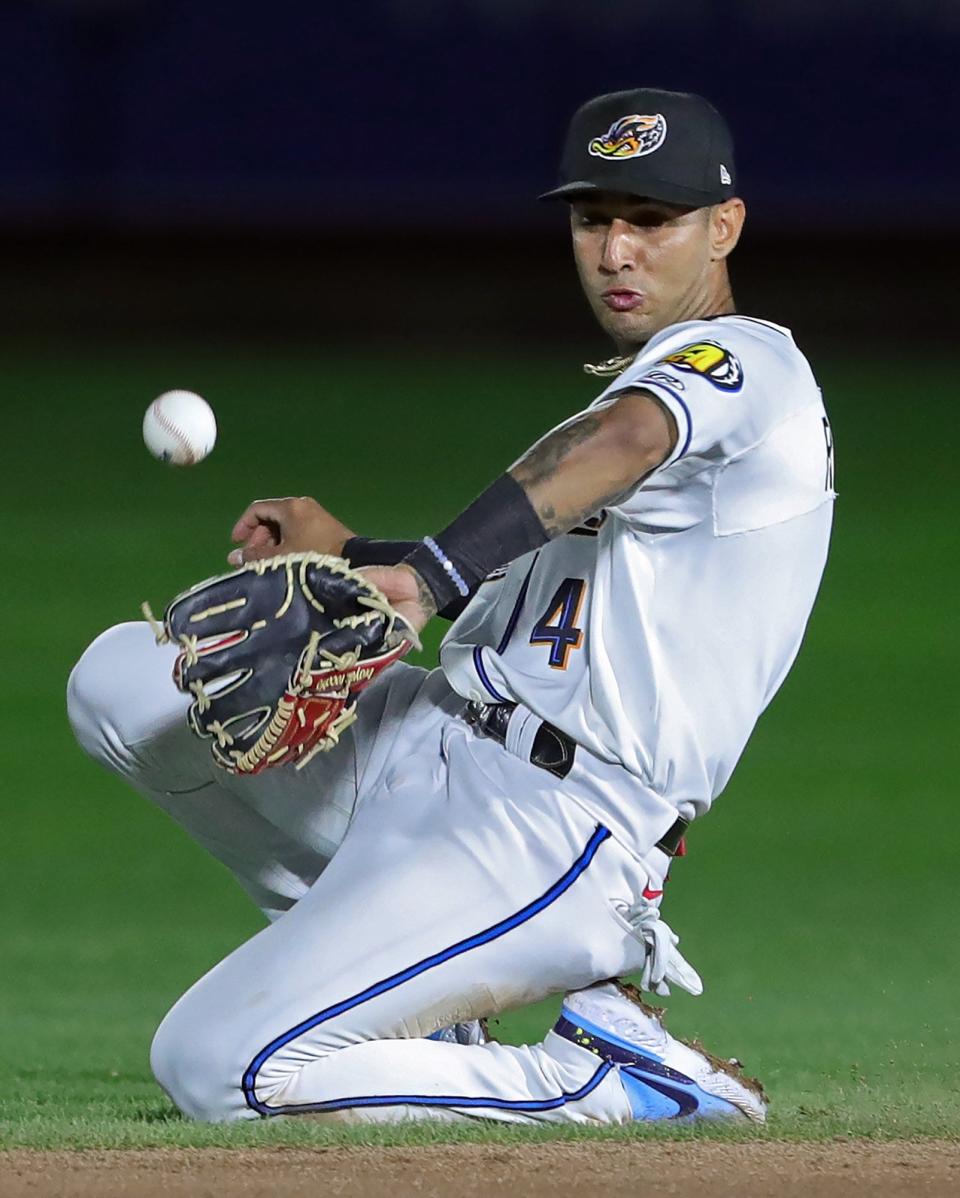 RubberDucks second baseman Brayan Rocchio (4) makes a sliding attempt at a ball hit up the middle by the Reading Fightin Phils'  Logan O'Hoppe (6) on April 13, 2022, in Akron. The Guardians announced Rocchio will be the MLB team's starting shortstop to open the 2024 season.