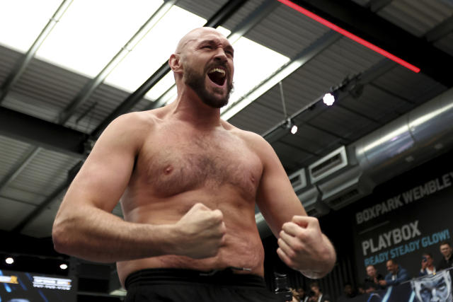 British boxer Tyson Fury attends an open workout for the media and fans at Wembley&#39;s Boxpark in London, Tuesday, April 19, 2022. Fury will defend his WBC heavyweight title against Dillian Whyte at Wembley Stadium Saturday. (AP Photo/Ian Walton)