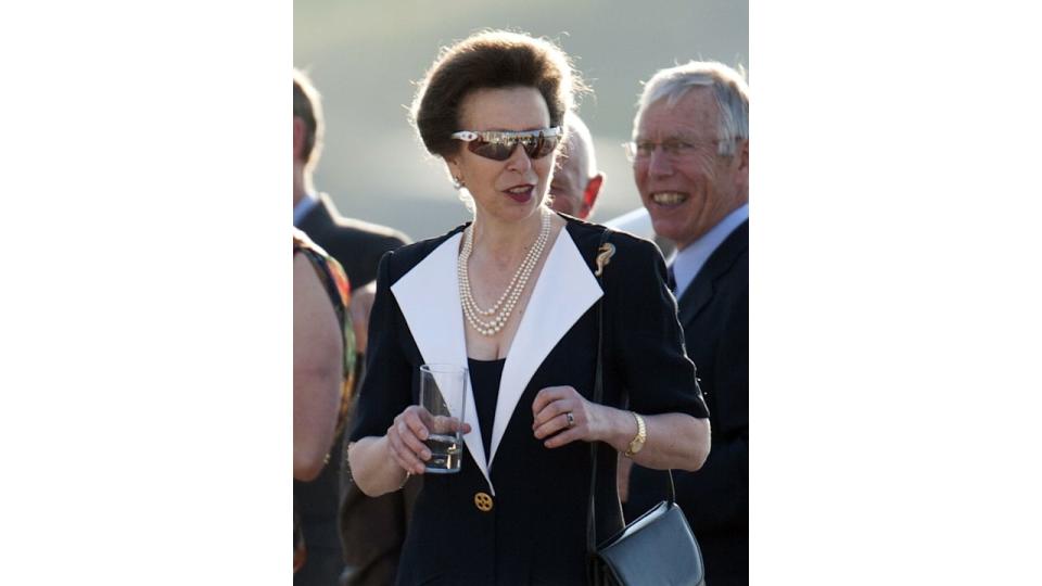 Princess Anne in a black blazer dress and sunglasses