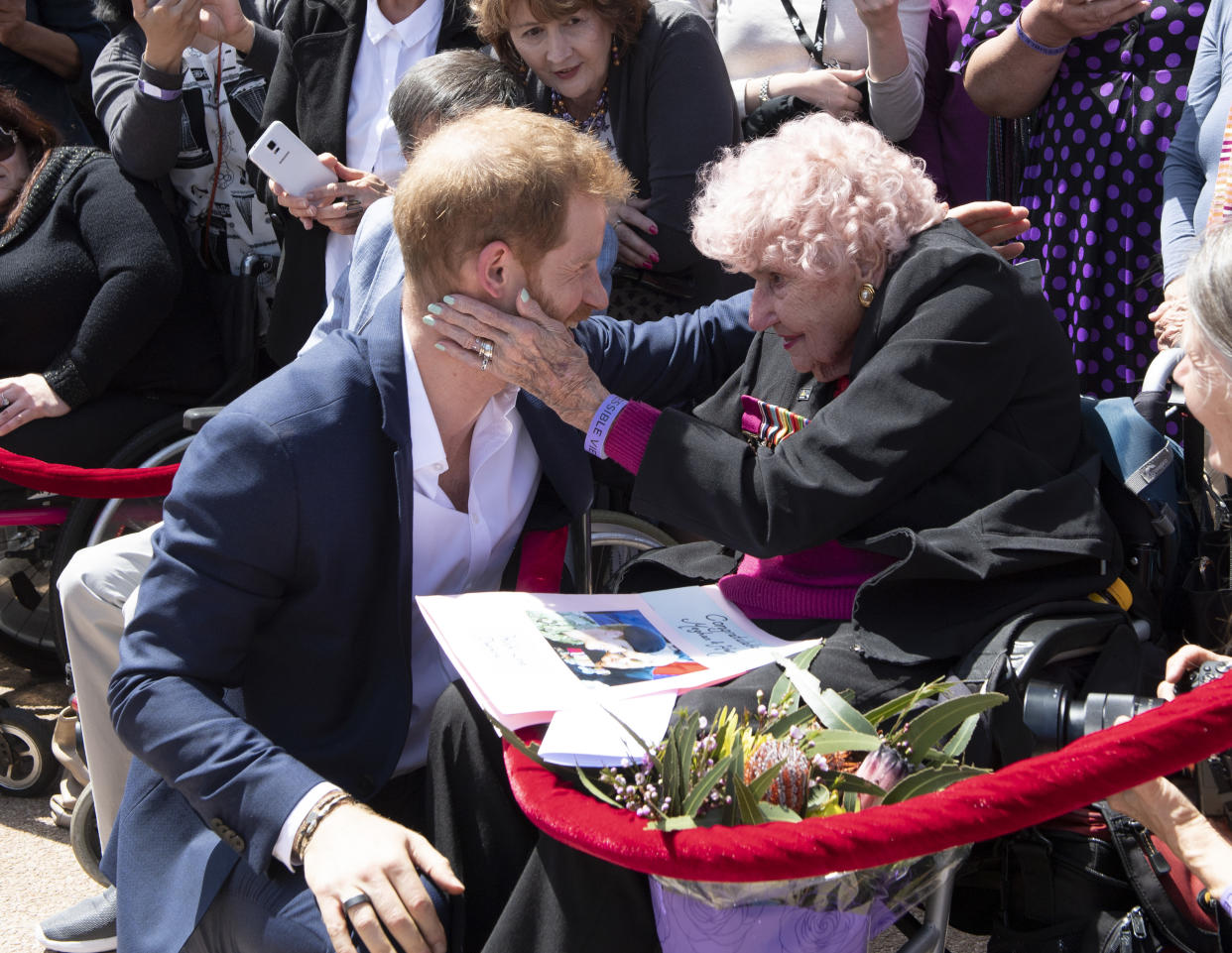 Harry embraces war widow Daphne Dunne, 98, in Sydney (Getty)