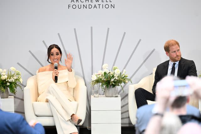 <p>Evan Agostini/Invision/AP</p> Meghan Markle and Prince Harry onstage at a summit for mental health