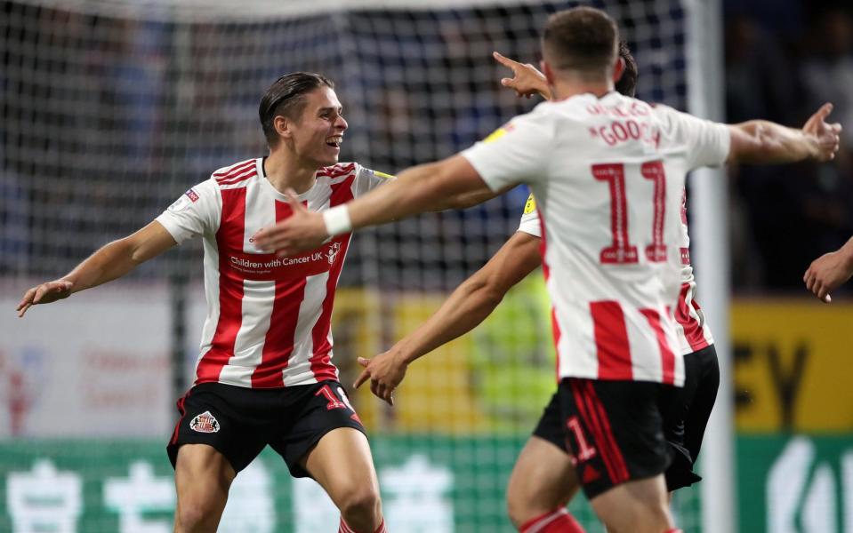 Sunderland's George Dobson (left) celebrates his sides third goal - PA