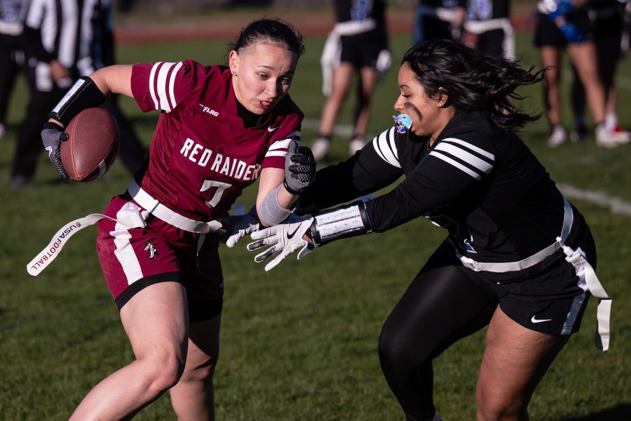 Fitchburg's Beautifull Sanchez is tackled by Leominster's Jalainy Santiago on Thursday at Crocker Field.