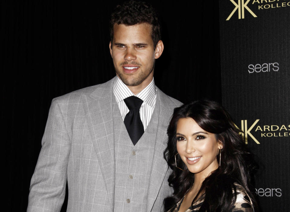 FILE - In this Aug. 17, 2011 file photo, reality TV personality Kim Kardashian, right, and her fiance, NBA basketball player Kris Humphries, arrive at the Kardashian Kollection launch party in Los Angeles. Humphries and Kardashian were married for 72-days and their divorce dragged on far longer than the marriage, threatening to keep her legally tethered to Humphries at the birth of her first child, with Kanye West. (AP Photo/Matt Sayles, File)