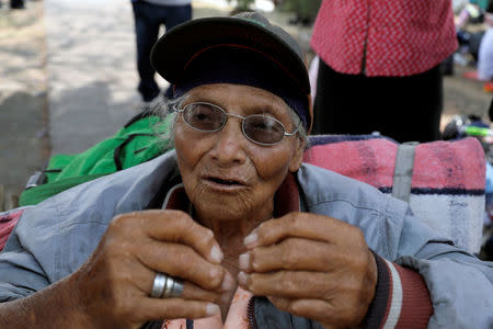 Irma Viviana Reyes from Guatemala looks on after arriving with fellow Central American migrants, who are moving in a caravan through Mexico toward the U.S. border, in Puebla, Mexico April 6, 2018. REUTERS/Henry Romero