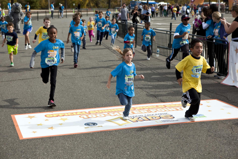 Children run to help National Geographic Kids set a Guinness World Records title for the most people to run 100 meters in 24 hours. <a href="http://kids.nationalgeographic.com/kids/?source=NavKidsHome
" rel="nofollow noopener" target="_blank" data-ylk="slk:(Photo by Brad Vest/National Geographic Kids);elm:context_link;itc:0;sec:content-canvas" class="link ">(Photo by Brad Vest/National Geographic Kids)</a>