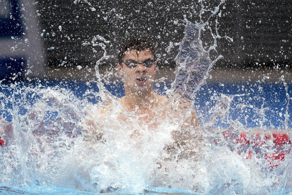 Evgeny Rylov of the Russian Olympic Committee celebrates after winning the final of the men's 100-meter backstroke final at the 2020 Summer Olympics, Tuesday, July 27, 2021, in Tokyo, Japan. (AP Photo/Martin Meissner)