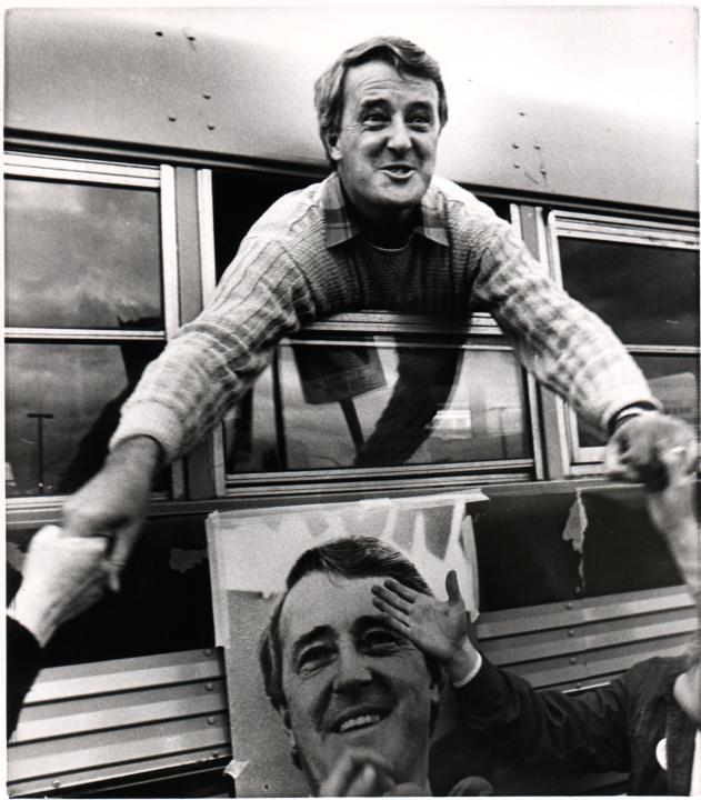 Brian Mulroney stretches through a bus window  to reach potential voters in Wabush, NF,  on his last stop of the federal campaign, Sept 2, 1984.  Two days later his Progessive Conservative party won the election and he became Prime Minister. (CP PHOTO/Fred Chartrand)