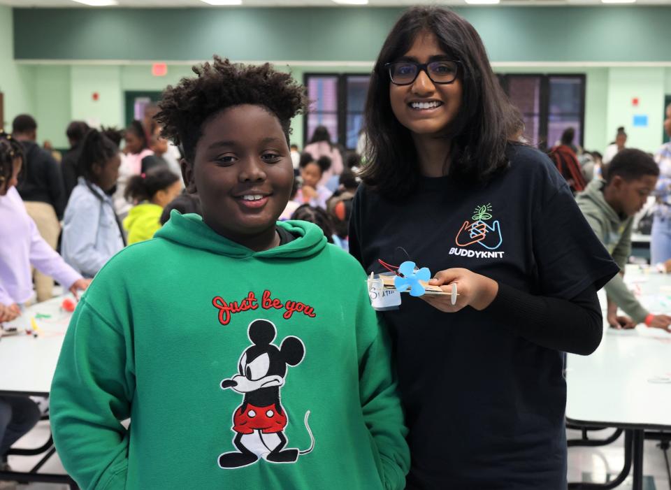 Sruthi Sentil, the organizer of the Bond Robotics Expo, poses for a photo with Bond Student Williem Taylor, 10, in the Bond Elementary School cafeteria on Thursday, Nov. 17, 2022.