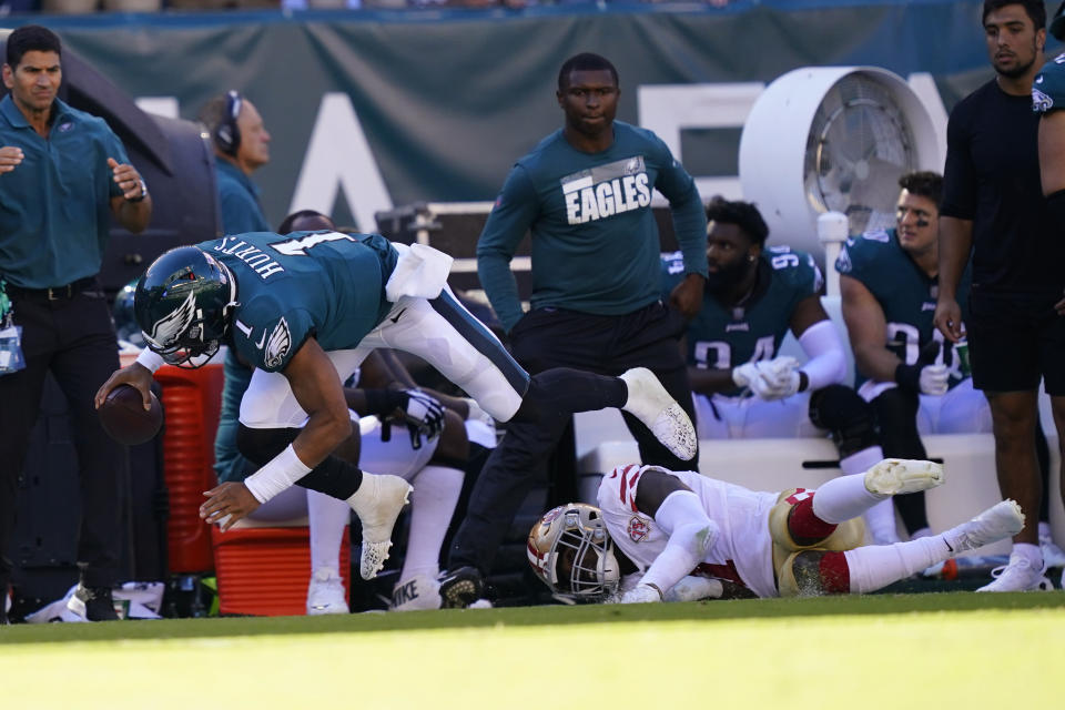 Philadelphia Eagles quarterback Jalen Hurts (1) falls with the ball during the second half of an NFL football game against the San Francisco 49ers on Sunday, Sept. 19, 2021, in Philadelphia. (AP Photo/Matt Rourke)