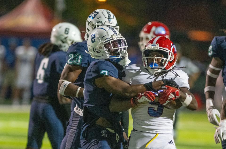 West Florida's Brandon Cross goes after West Georgia's Camyen Feagins during the Gulf South Conference opener against West Georgia at Pen Air Field at the University of West Florida Saturday, September 23, 2023.