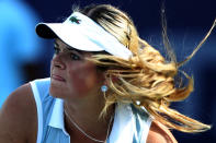 Aleksandra Wozniak of Canada watches a return to Angieszka Radwanska of Poland during their tennis match at the Duty Free Tennis Championship in Dubai, February 21, 2012. (Photo by Marwan Naamani/AFP/Getty Images)