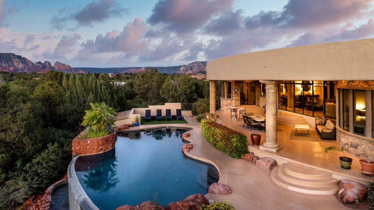 Vrbo says Palatial Paradise Estate, in Sedona, "invites the outside in with unique features including telescoping doors that connect the living room to the resort-style patio, an infinity pool, waterfall feature and outdoor fireplace."