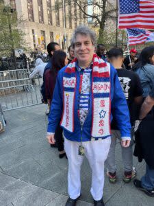 Trump supporter Steve Merczynski of New York City wore a hand-embroidered scarf declaring “MAGA again" outside Manhattan Criminal Court on Monday, April 15, 2024, as Trump's trial began. (Photo by Zachary Roth/States Newsroom)