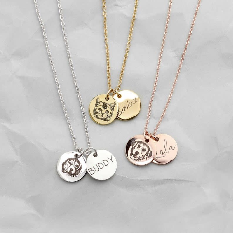<p><strong>MignonandMignon</strong></p><p>etsy.com</p><p><strong>$19.50</strong></p><p>No pet parent can resist seeing their fur baby's face engraved on a gold, silver or rose gold pendant. Before you place your order, convince them to send a recent snap of their pet, so it can look as accurate as possible. </p>
