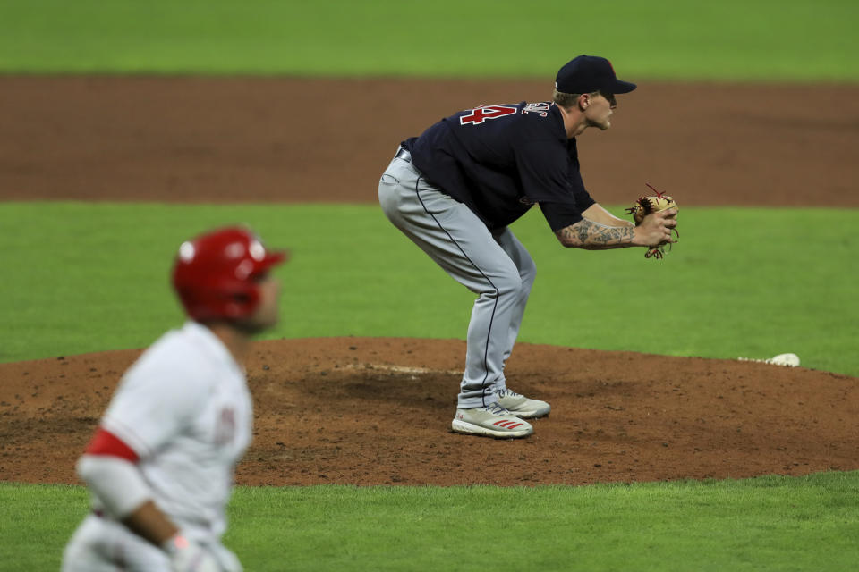 Cleveland Indians' Zach Plesac (34) reacts to a two-run home run by Cincinnati Reds' Joey Votto during the sixth inning during a baseball game in Cincinnati, Monday, Aug. 3, 2020. (AP Photo/Aaron Doster)