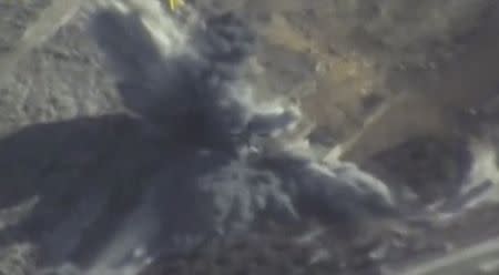 A still image taken from a video footage and released by Russia's Defence Ministry on September 25, 2017, shows a missile hitting a building which Defence Ministry said was an Islamic State target in Syria. Russian Defence Ministry/Handout via REUTERS TV