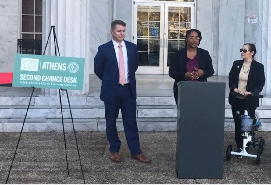 Georgia Justice Project Staff Attorney Tiffany Gordon, center, speaks during ribbon cutting Thursday. She is flanked by Athens-Clarke Solicitor Will Fleenor, left, and Western Circuit District Attorney Deborah Gonzalez.